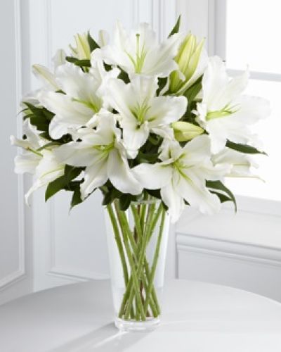 <p>The bouquet features stunning Oriental lilies, prized for their soft fragrance and symbolism of purity. Accented with fresh, lush greenery and arranged in a clear glass vase, this design offers a refined and soothing presence.</p>