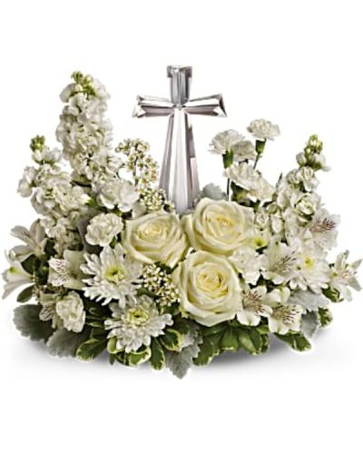<p>This elegant bouquet features a fragrant mix of white roses, alstroemeria, stock, carnations, and waxflower. Accented with dusty miller and variegated pittosporum, the flowers are artfully arranged around a crystal cross keepsake—an inspiring centerpiece that adds meaning beyond the blooms.</p>