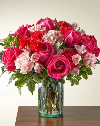 <p>Handcrafted and inspired by the gorgeous hues of the season, the You’re Precious Bouquet is full of sweet sentiment for your favorite person. Hot pink roses, red carnations, pink alstroemeria, and pale pink carnations come together in a clear glass vase to make any room feel beautiful and light.</p>