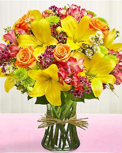 <p>This bouquet features a fresh, elegant mix of roses and seasonal blooms arranged with care and attention to detail. Presented in a tasteful vase, the arrangement comes together in a display that radiates love, appreciation, and thoughtful intention.</p>